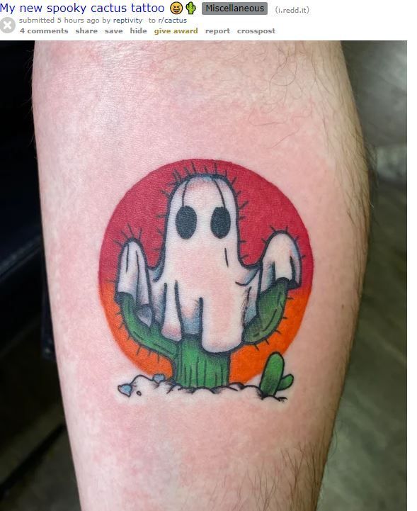 a person with a small tattoo on their leg that has a ghost in the middle