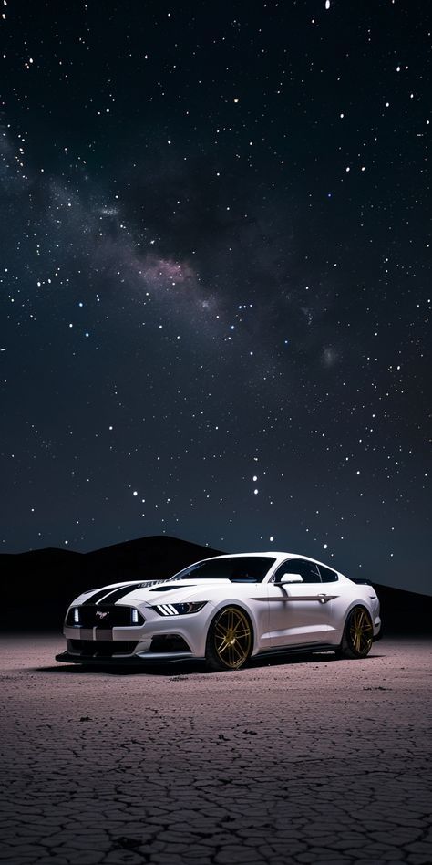 a white sports car parked in the desert at night with stars and clouds above it