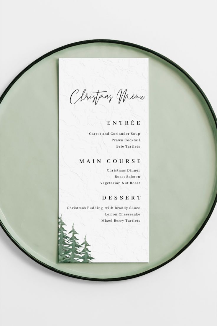 a green plate with a menu on it and some pine trees in the back ground