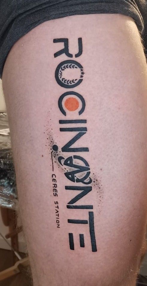 a person with a tattoo on their thigh