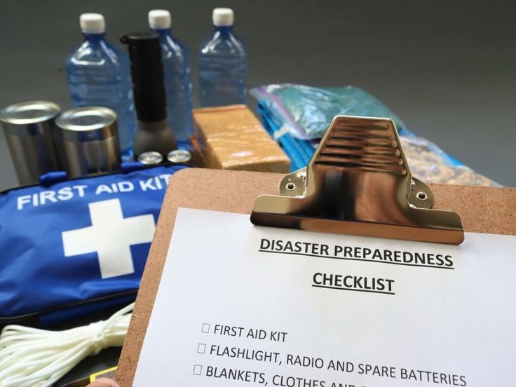 a clipboard with a checklist on it next to other medical supplies and items