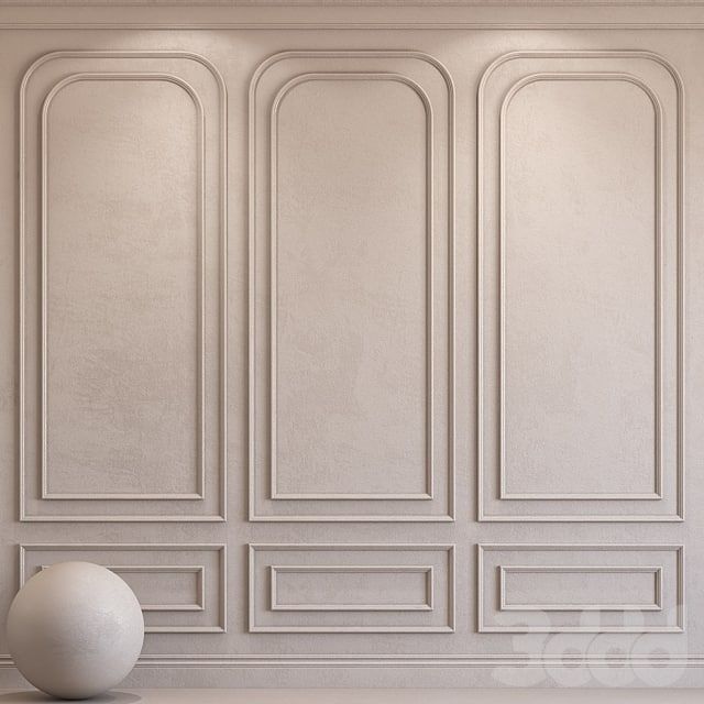 an empty room with a large white ball on the floor in front of a paneled wall