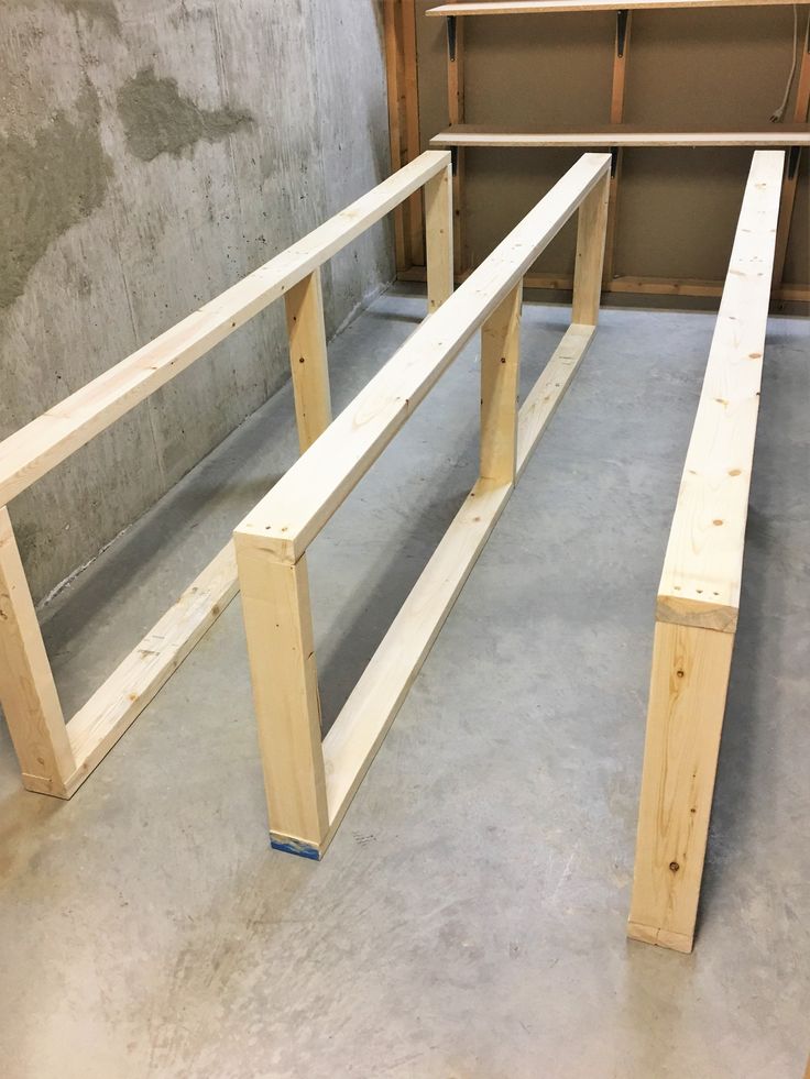 two wooden benches sitting on top of a floor next to each other in a room