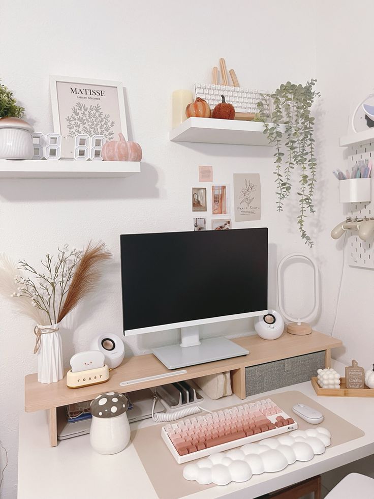 a computer monitor sitting on top of a desk