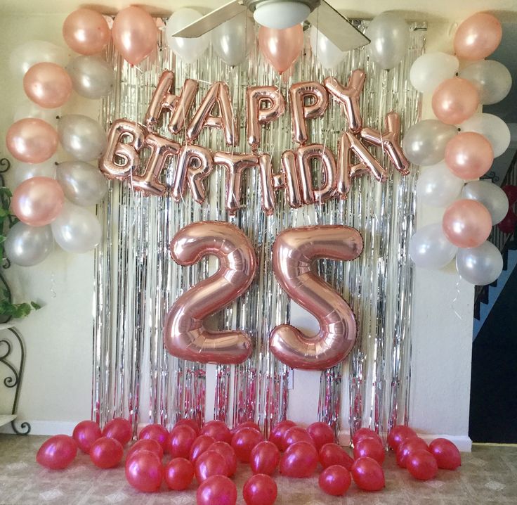 a birthday decoration with balloons and streamers in the shape of the number twenty two