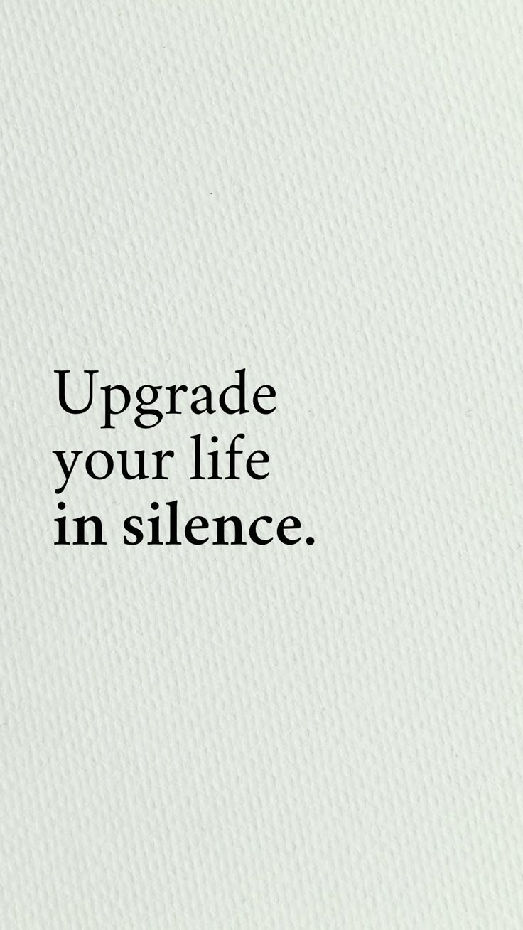 the words upgrade your life in silence are written on a white paper with black lettering