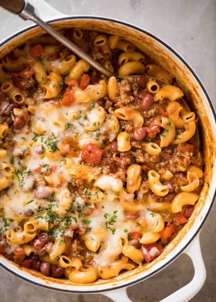 a large pot filled with pasta and meat