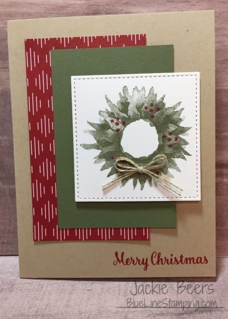 a christmas card with a wreath on it