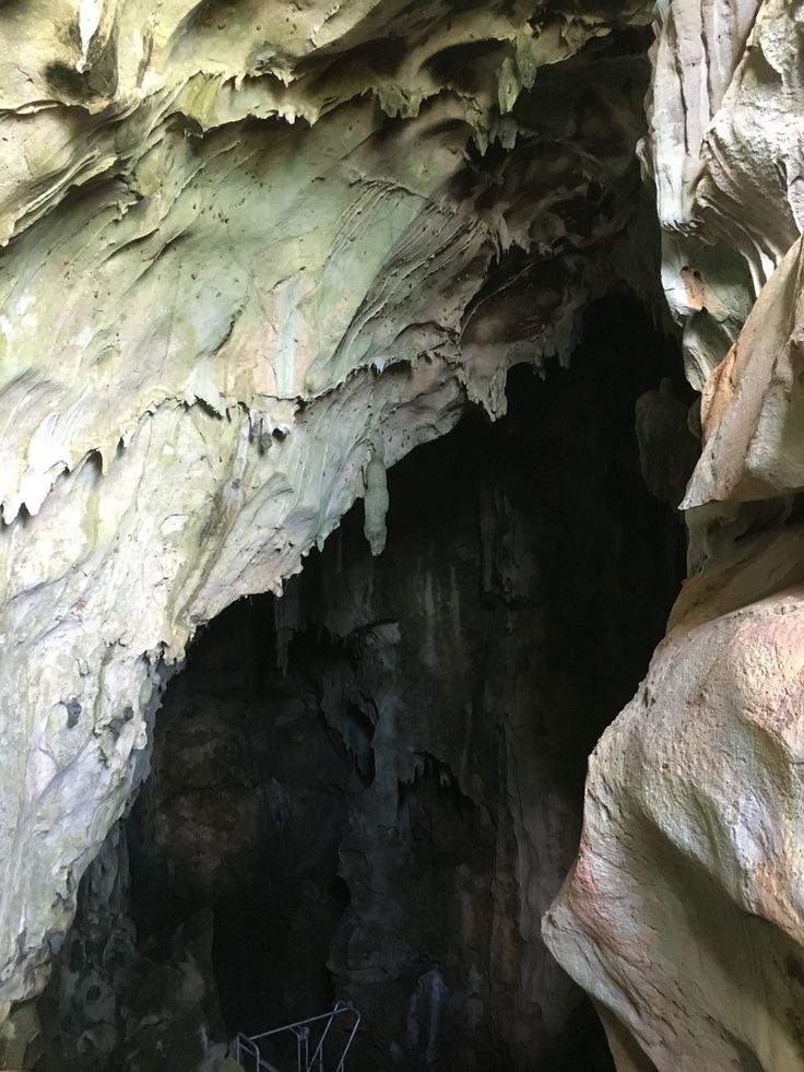 the inside of a cave with lots of rock formations