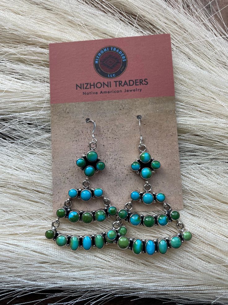 New without tags* JEWELRY TYPE : Earrings * METAL : Sterling Silver * MAIN STONE : Turquoise * TRIBAL AFFILIATION : Navajo     These are a beautiful pair of Navajo Sterling Silver and Sonoran Mountain Turquoise Dangle Earrings. These earrings measure 2 1/2 inches long and 1 1/2 inches wide.      Thank you for looking at our items. Please contact us if you have any questions.     2/15/23    Exported By ExportYourStore :) SKU:436849443145_973E* Turquoise Dangle Earrings, Knot Bangle, Bouquet Charms, Native American Earrings, Turquoise Earrings Dangle, Photo Charms, Earrings Metal, Silver Chain Bracelet, Engraved Jewelry