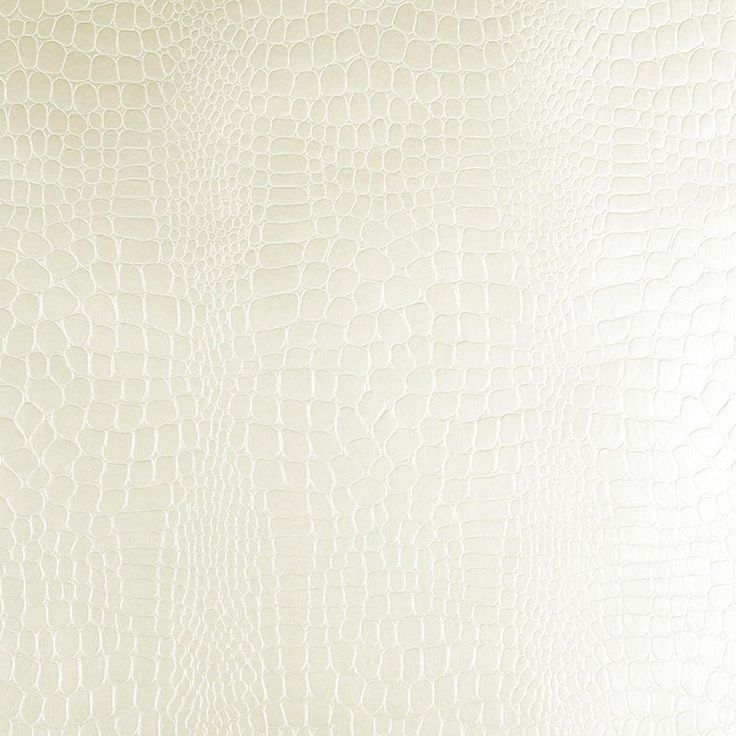 white leather textured up close to the surface with an interesting pattern on it's surface