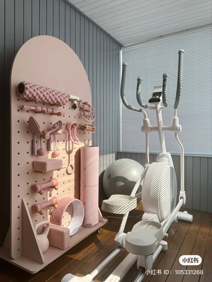 there are many different items on the wall in this room, including an exercise bike