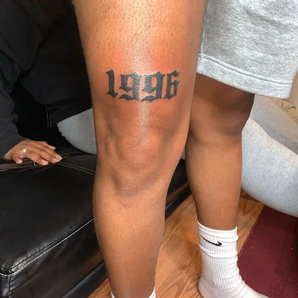 a person with a tattoo on their leg that reads,'hope'in black ink