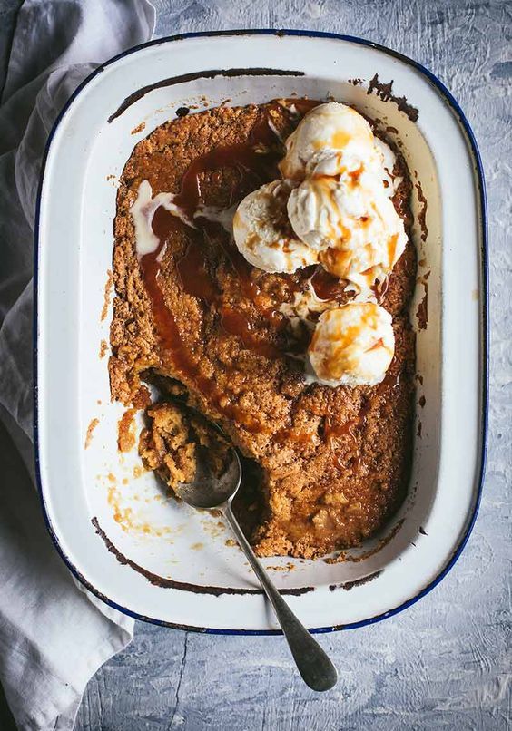 a dessert dish with ice cream and caramel sauce