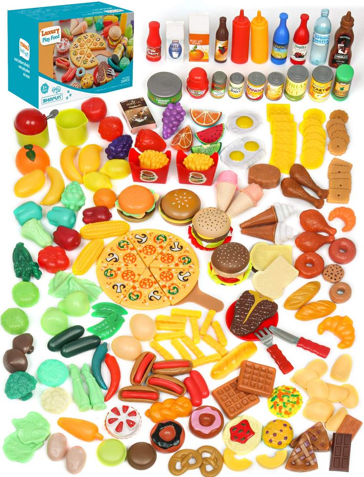 a bunch of toys that are on a white surface and in the shape of a pizza