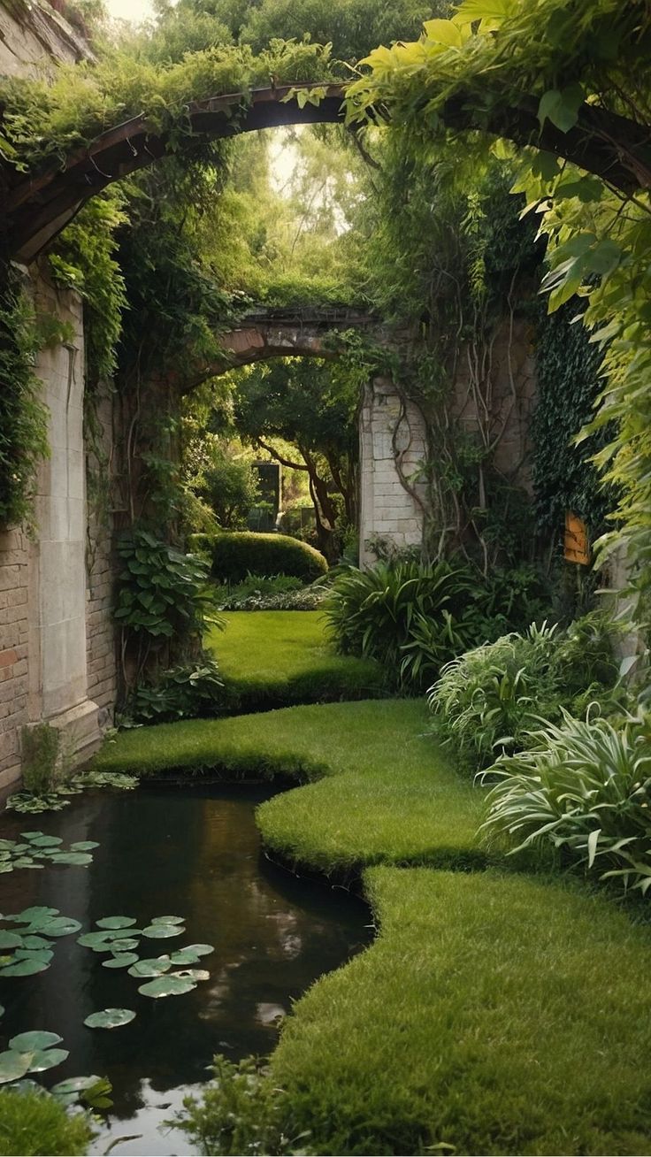 an outdoor garden with water lilies and greenery on the walls, along with a small pond