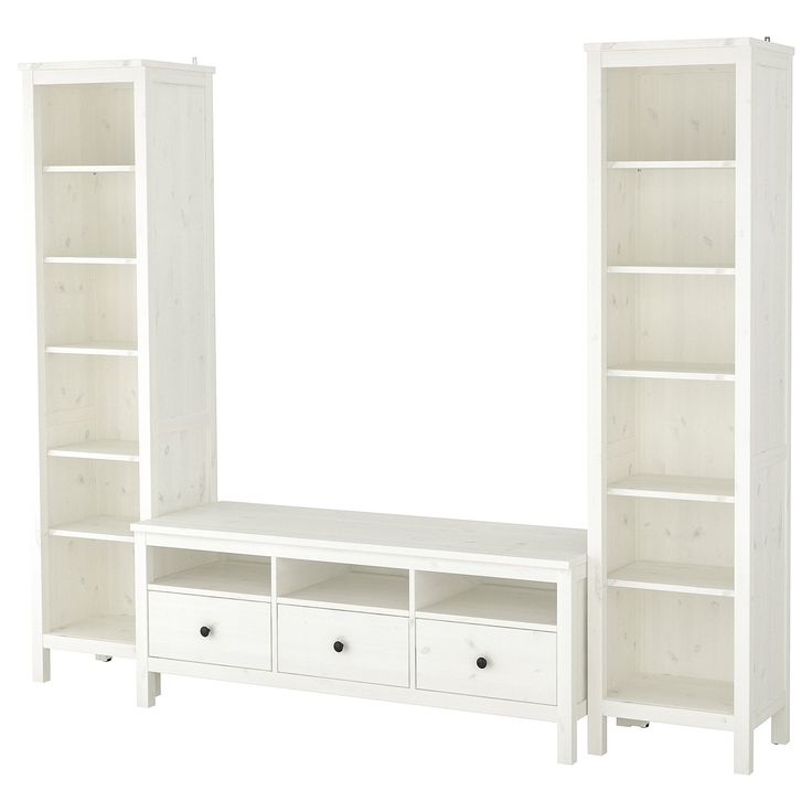 a white bookcase with drawers and shelves next to each other on a white background