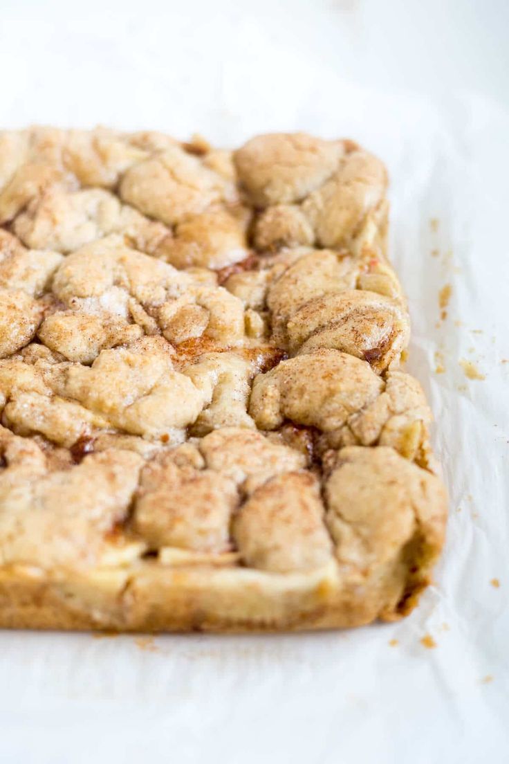 a square pastry sitting on top of a piece of paper