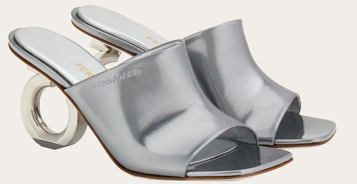 Sole material: Leather Closure type: Slip On Water resistance level: Not Water Resistant About this item embossed logo to the side patent finish branded leather insole Women's Mules, Leather Slides, Embossed Logo, Salvatore Ferragamo, Water Resistant, Slip On, Water, Silver, Leather