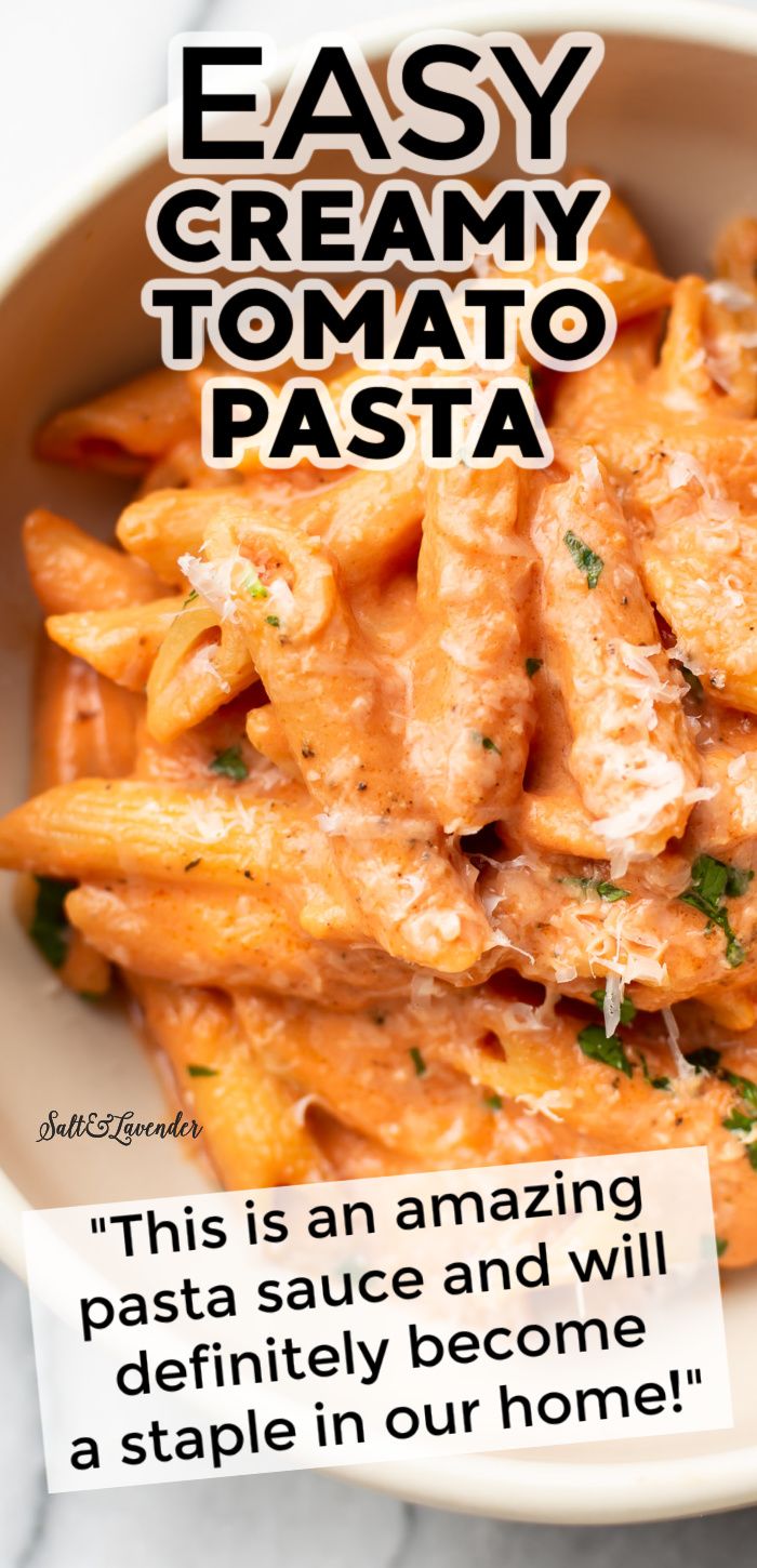 a bowl filled with pasta and sauce on top of a table