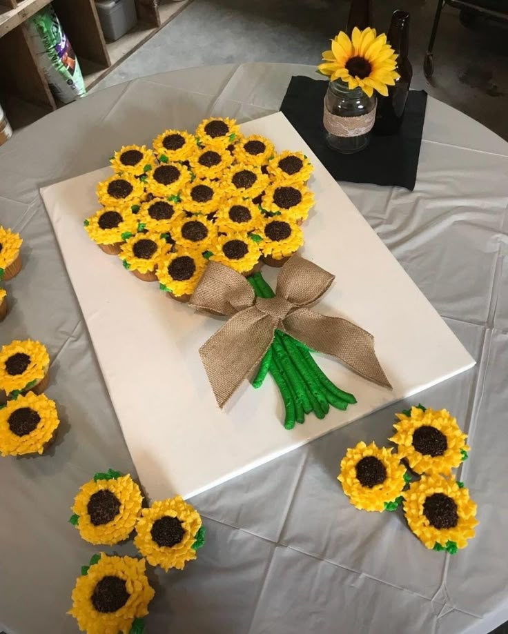 sunflowers are arranged on a white table