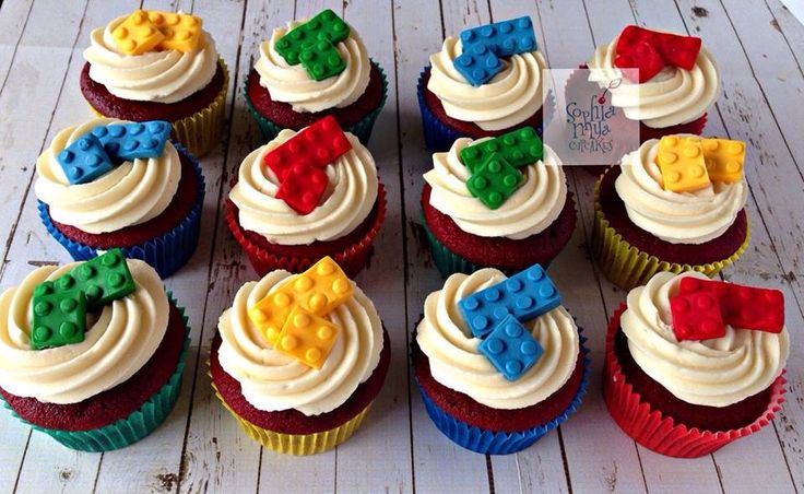 there are many cupcakes with lego decorations on them