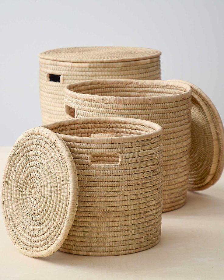 three woven baskets sitting on top of a table