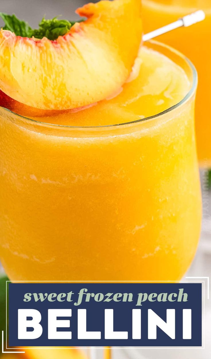 two glasses filled with orange juice and garnished with fresh mint on the rim