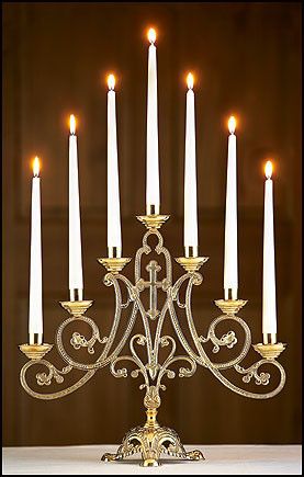 a large metal candelabra with many lit candles