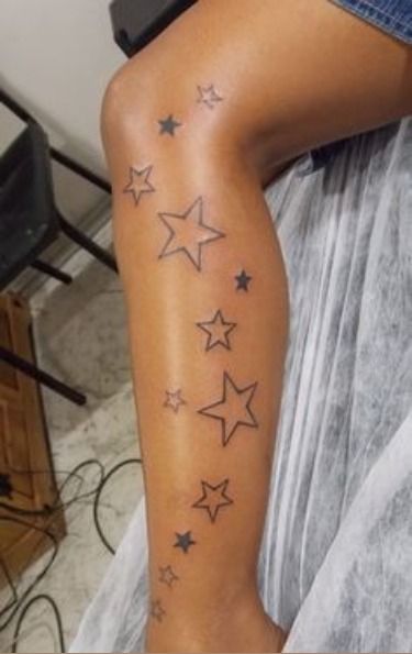 a woman's arm with stars on it