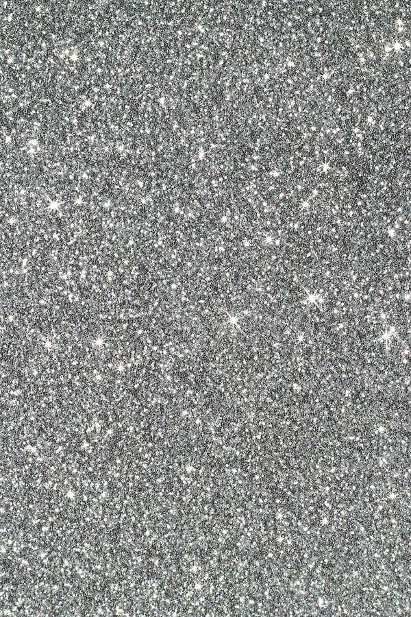 silver glitter textured background with small white stars