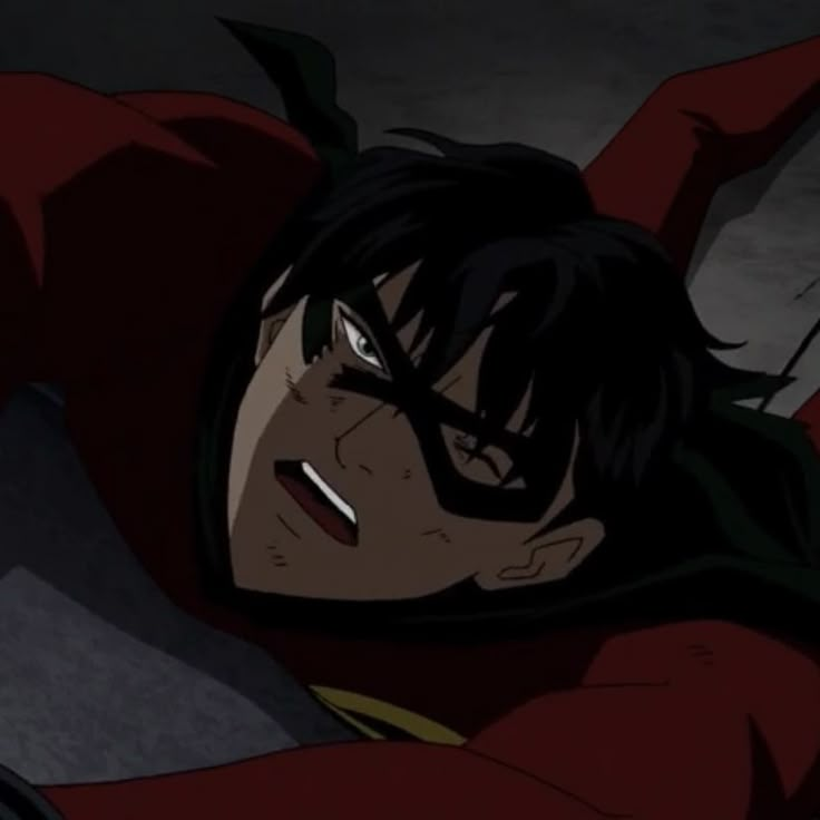 an anime character laying on the ground with his head down and eyes open, wearing a red cape