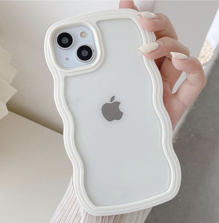 a person holding an iphone case in their hand with the back cover partially open to show the camera lens