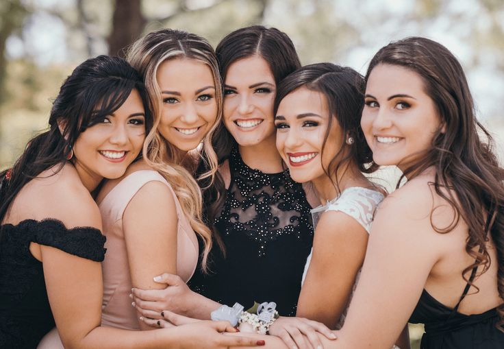 a group of young women standing next to each other