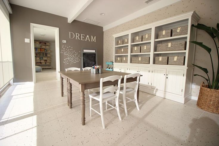 the dining room is clean and ready for us to use it's own bookshelves