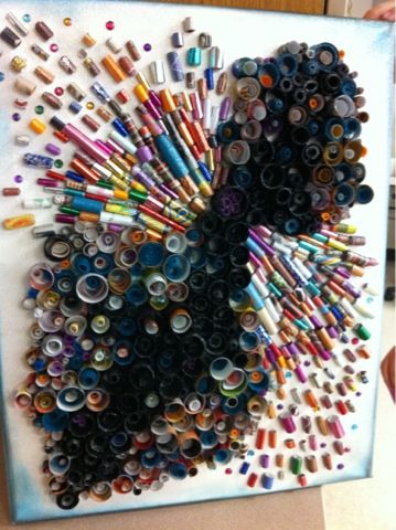 an art piece made out of many different colored pencils