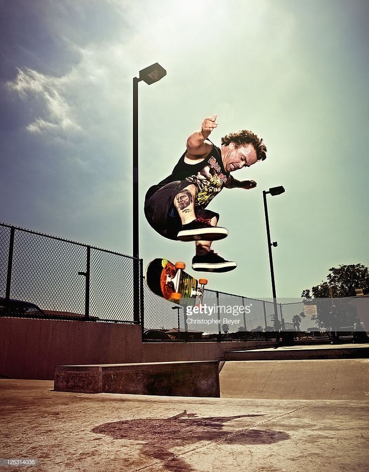 a man flying through the air while riding a skateboard