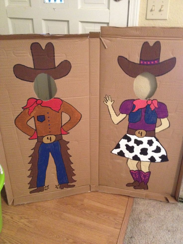 two cardboard boxes with cowboy cut outs on them