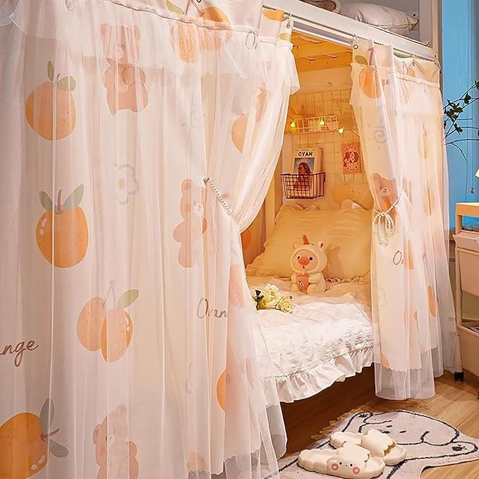 a child's bedroom with an orange themed canopy bed and white curtained drapes