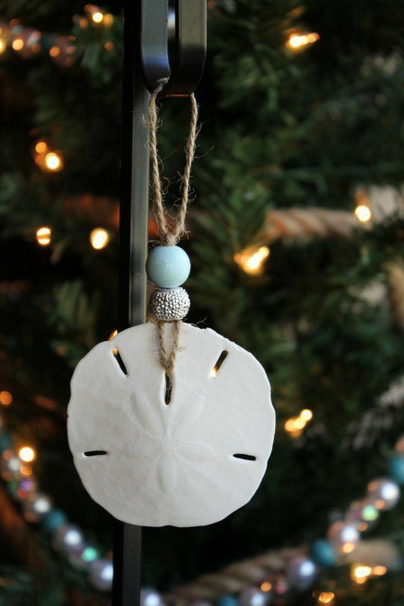 a christmas ornament hanging from a pole