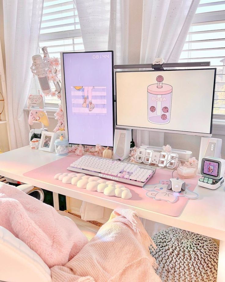 a desk with two computer monitors and a keyboard