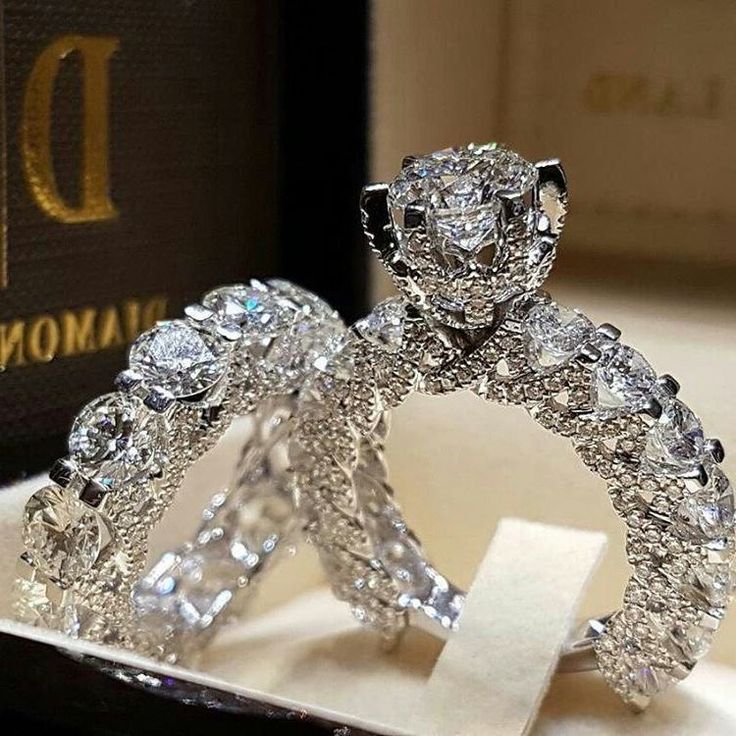 a close up of a diamond ring on a table with the words poshmark