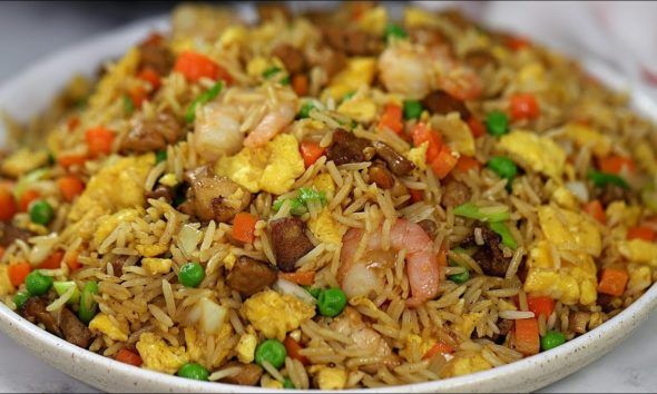 rice with shrimp and peas in a white bowl