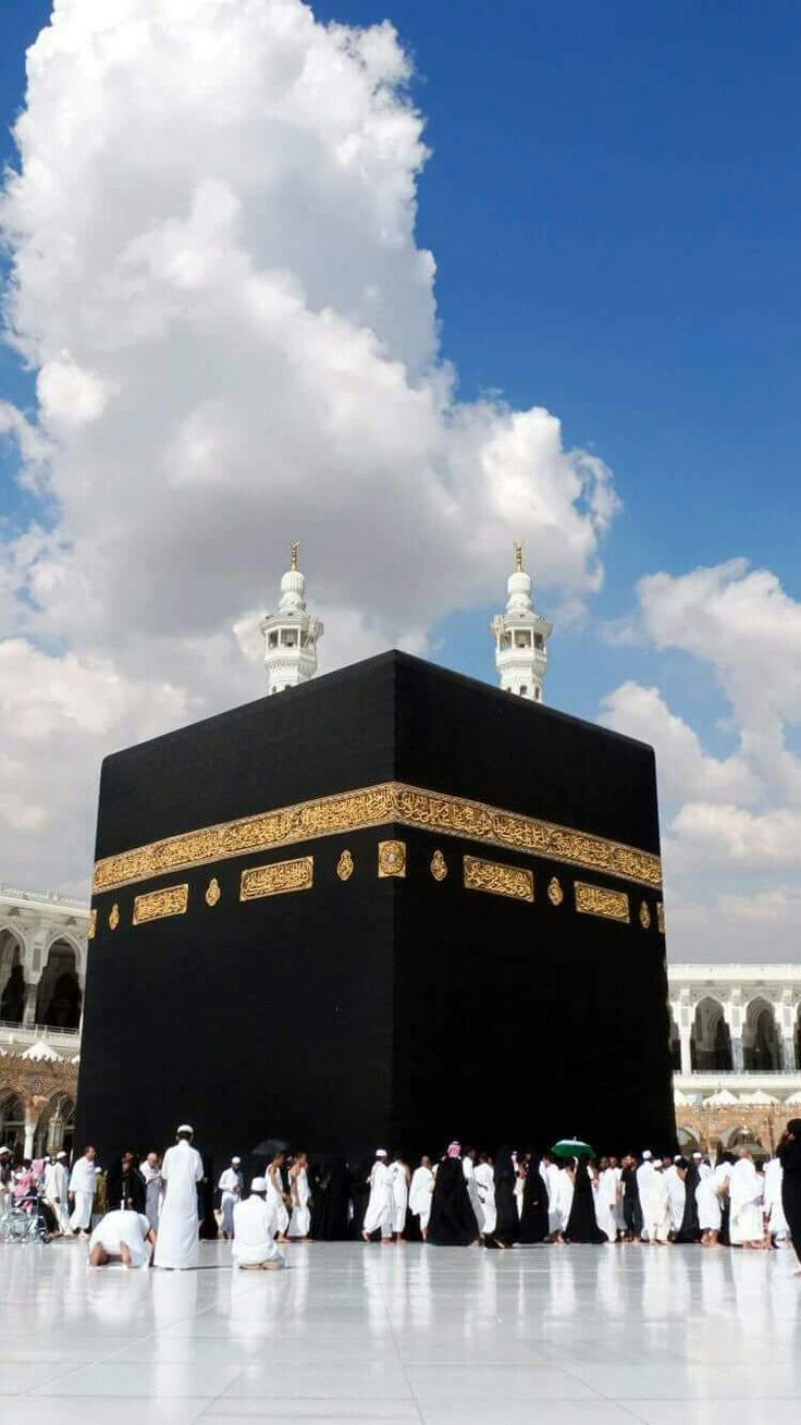 the ka'bah in the middle of an open area with many people around it