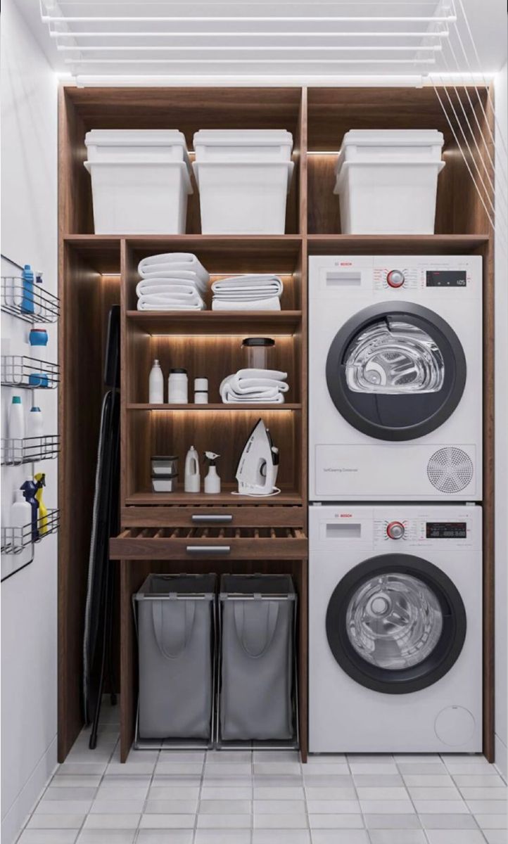 a washer and dryer sitting in a room next to each other on shelves