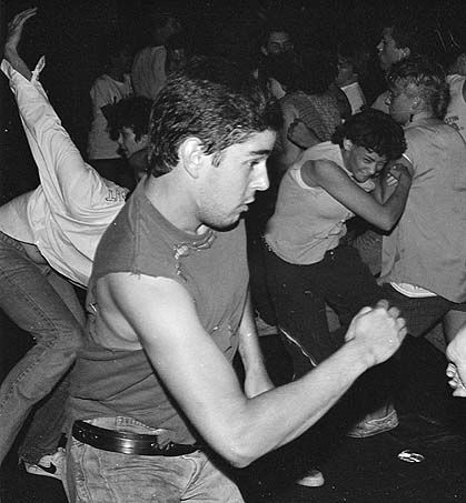 black and white photograph of people dancing at a party