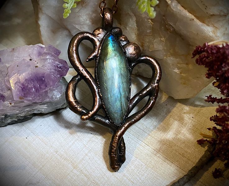 A copper electroformed hand sculpted pend with labradorite. Attached to an adjustable copper chain. ~ Copper electroforming is an electro-chemical process that deposits a thick layer of copper on any object. ~ Feel free to message me with any questions or concerns you may have. *Visit my other shop for ethically sourced bone and insect jewelry, more electroformed items and to see my customer reviews! - malikamorbid.etsy.com Mystical Hand Forged Copper Necklaces, Mystical Hand Forged Copper Necklace, Mystical Bronze Copper Jewelry, Electroforming Jewelry, Copper Electroforming, Jewelry Gothic, Filigree Necklaces, Insect Jewelry, Electroformed Jewelry