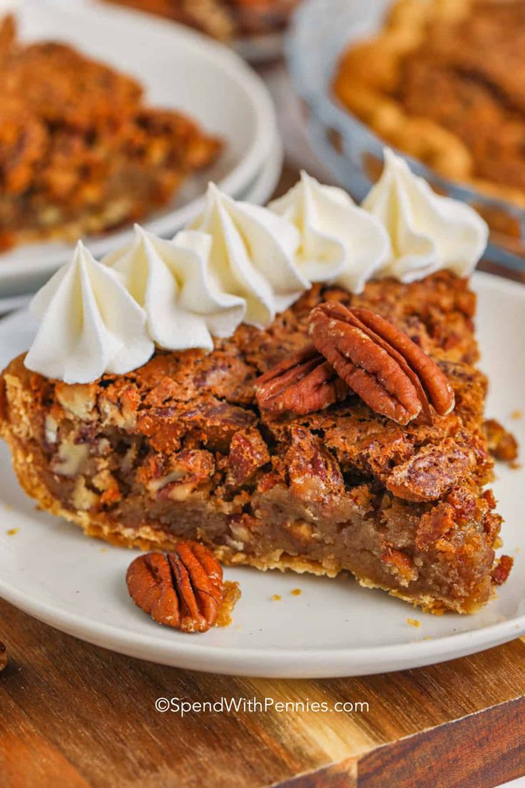 a slice of pecan pie with whipped cream on top