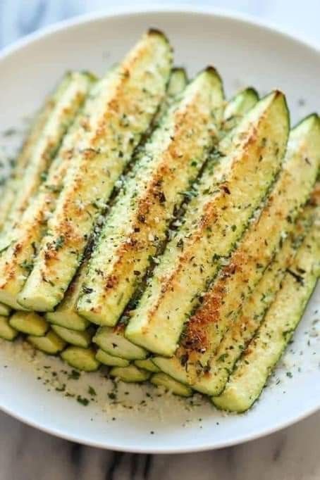 grilled zucchini on a plate with seasoning