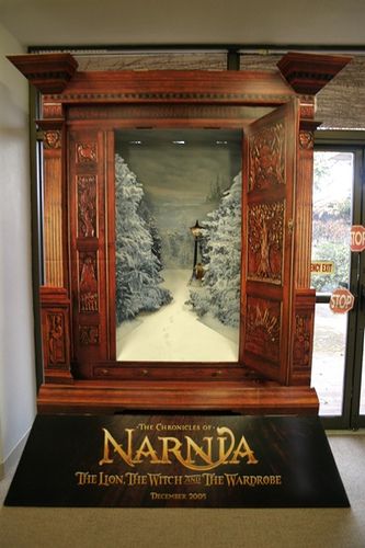 the entrance to narnda is displayed in front of an open door with snow covered trees